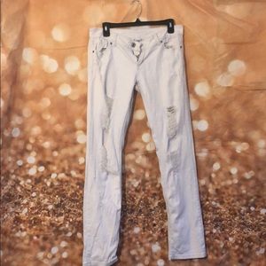 Distressed white jeans